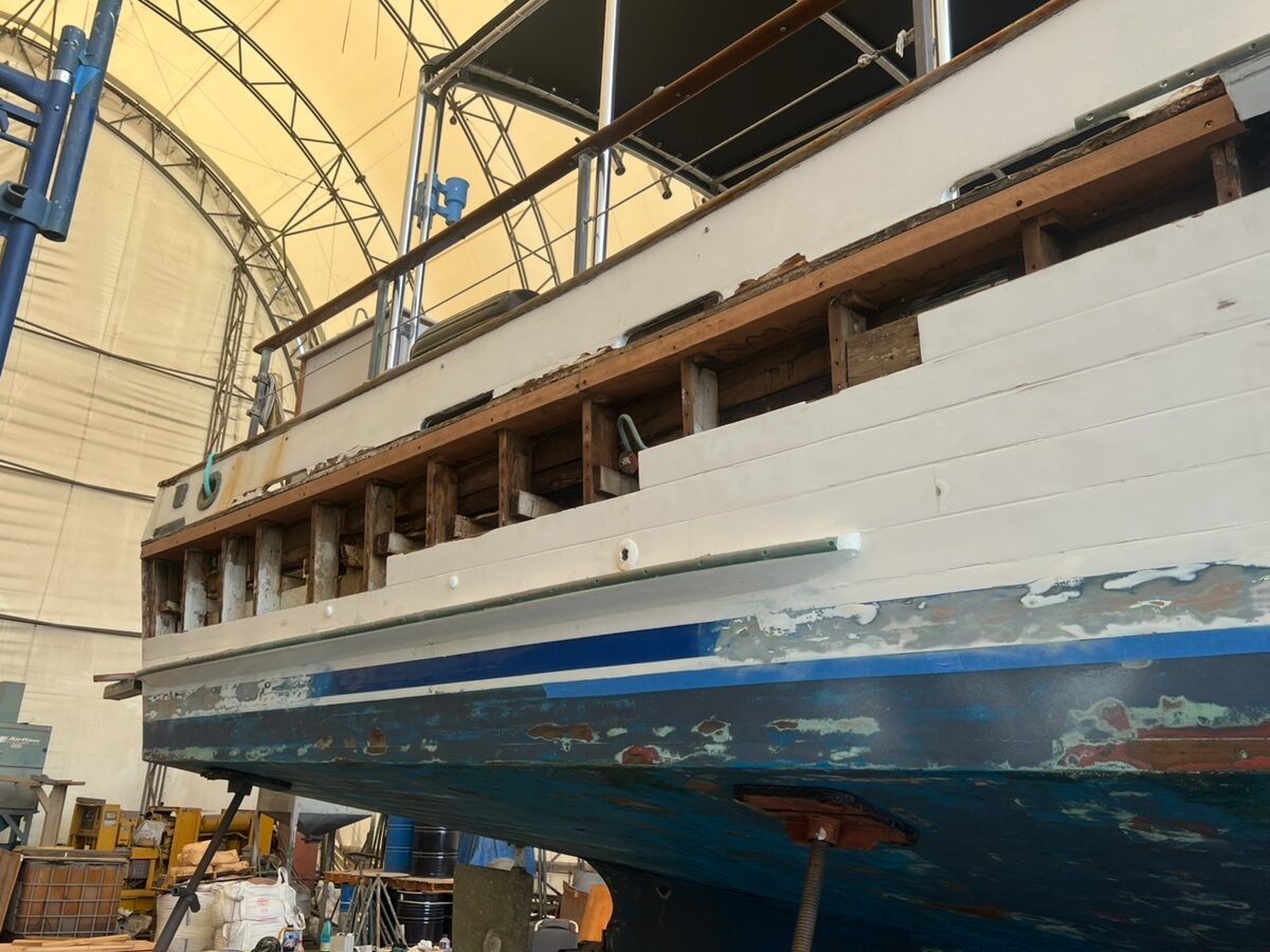 Boat hull with bottom paint and repair work visible