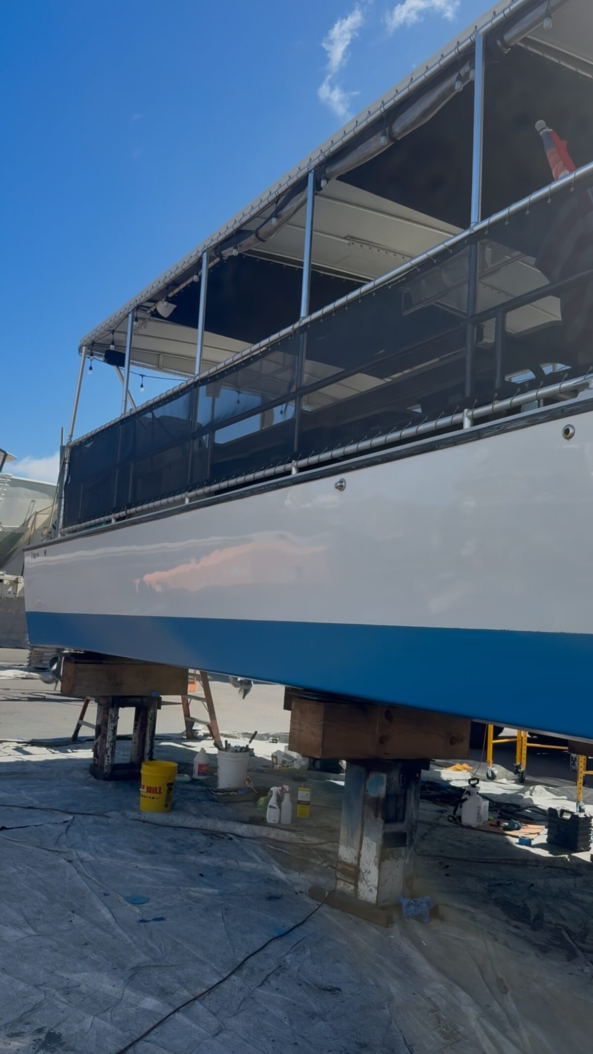 Boat on stands during haul-out work in a yard